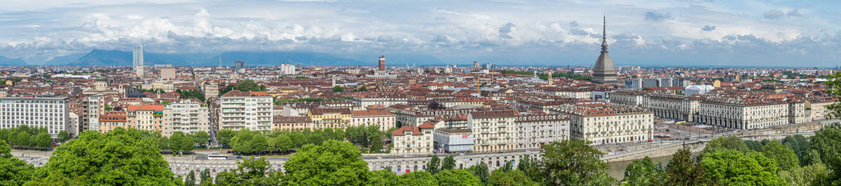 Extra wide angle aerial view of the skyline of turin with the mole antonelliana