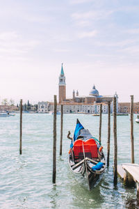 Gondola in grand canal against church of san giorgio maggiore