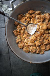 High angle view of meat in cooking pan on table