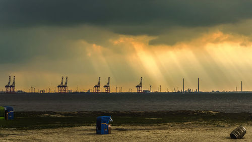 Scenic view of beach against sky during sunrise