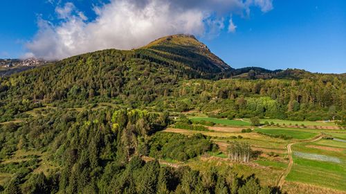 Panoramic view of farm against sky