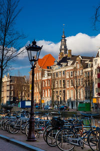 Bicycles on street by buildings in city