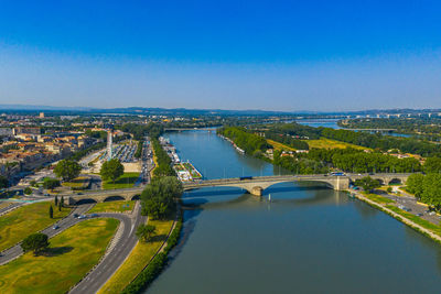 High angle view of bridge over river against blue sky