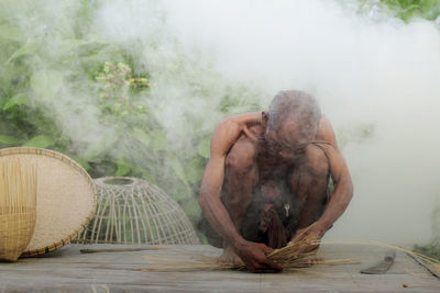 Man holding wicker basket