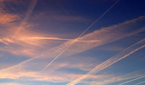 Low angle view of vapor trails in sky