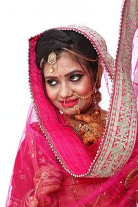 Portrait of a beautiful young woman over white background