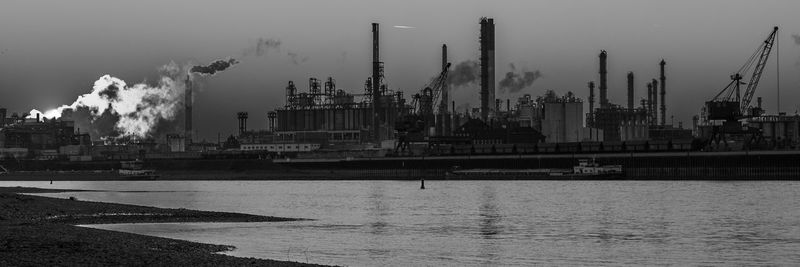 Panoramic view of factory against sky