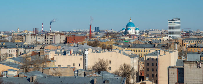 Panoramic view of buildings in city against sky