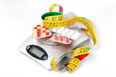 Close-up of multi colored pencils over white background