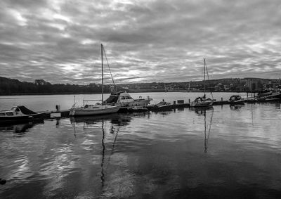 Boats moored in sea