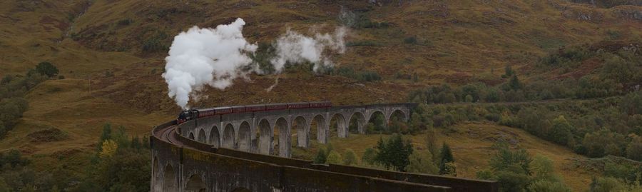 The classical harry potter shot - glenfinnan viaduct panorama with the jacobite steam train