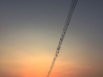 Low angle view of vapor trails in sky