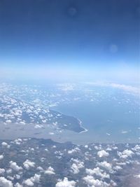 Aerial view of clouds over sea against sky