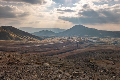 Scenic view of landscape and mountains against sky