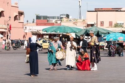 People walking on street in city