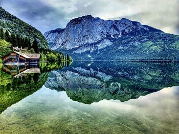 Scenic view of lake and mountains against sky