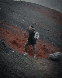 High angle view of man standing on rock