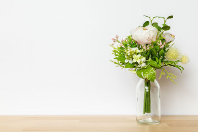 Close-up of white flower vase on table