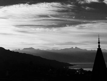 Scenic view of mountains against cloudy sky