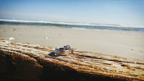 Close-up of beach against sky