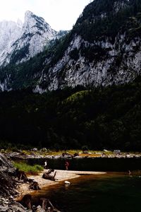 Scenic view of lake and mountains against sky