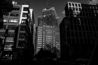 Low angle view of buildings in city at night