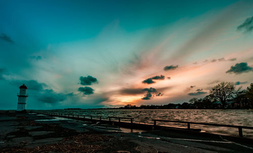 Scenic view of sea against sky at sunset