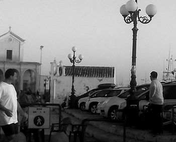 Woman standing by railing