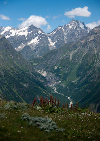 Scenic view of snowcapped mountains against sky