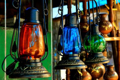 Close-up of lighting equipment hanging at store