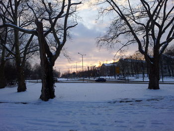 Scenic view of snow covered landscape against cloudy sky