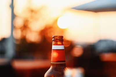 Close-up of beer bottles against blurred background