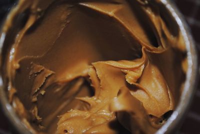 Close-up of peanut butter in jar