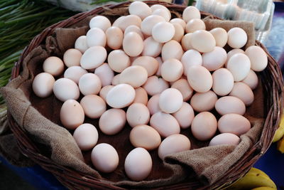 High angle view of eggs in basket for sale at market