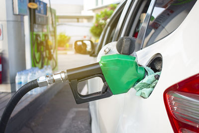 Close-up of fuel pump refueling car