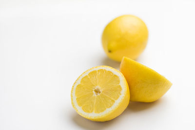 Close-up of lemon against white background