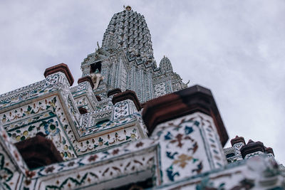 Low angle view of ornate building against sky