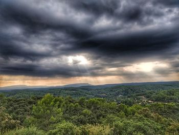 Scenic view of landscape against cloudy sky