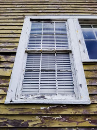 Low angle view of window of old building