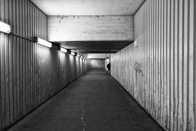 Walkway in illuminated corridor