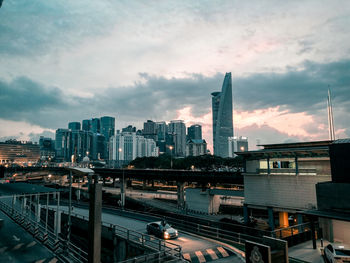 High angle view of modern buildings in city against sky