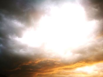 Low angle view of cloudy sky during sunset