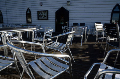 Empty chairs and tables in restaurant