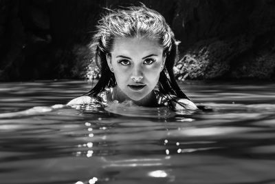 Portrait of woman swimming in pool