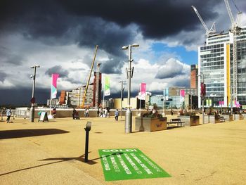 Lifeguard hut at beach against sky in city