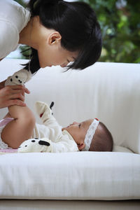 Close-up of mother holding baby