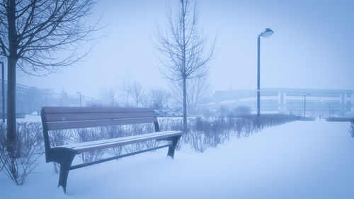 Snow covered landscape against clear sky