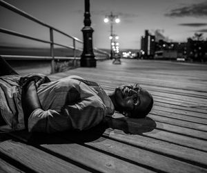 Woman relaxing on pier