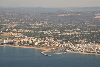 High angle view of river amidst buildings in city