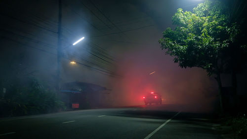 View of illuminated street at night